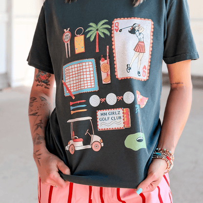 Person wearing a black t-shirt with colorful graphics and text.