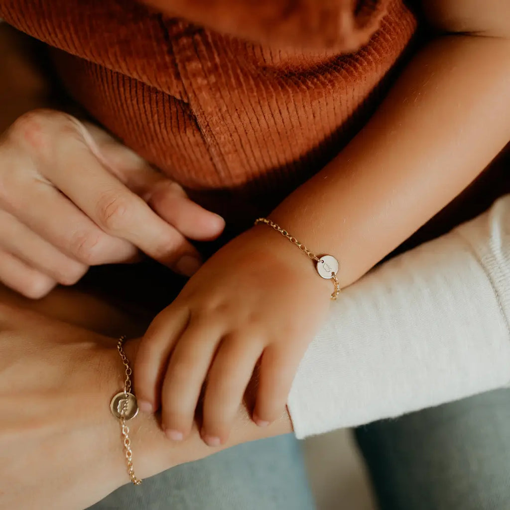 mom and daughter with matching bracelets