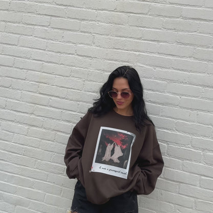 woman wearing graveyard smash sweashirt