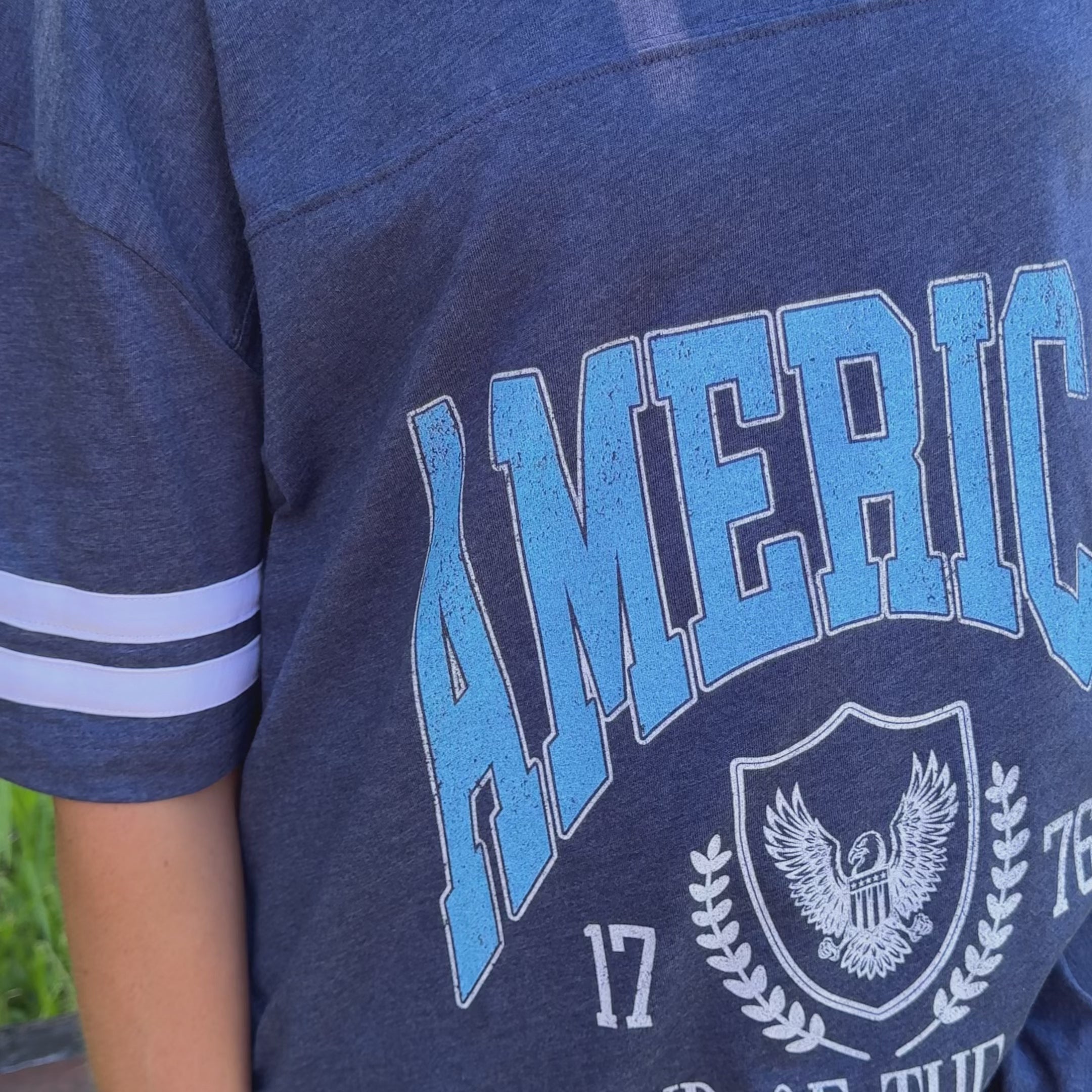 model wearing Land of the Free Jersey Tee
