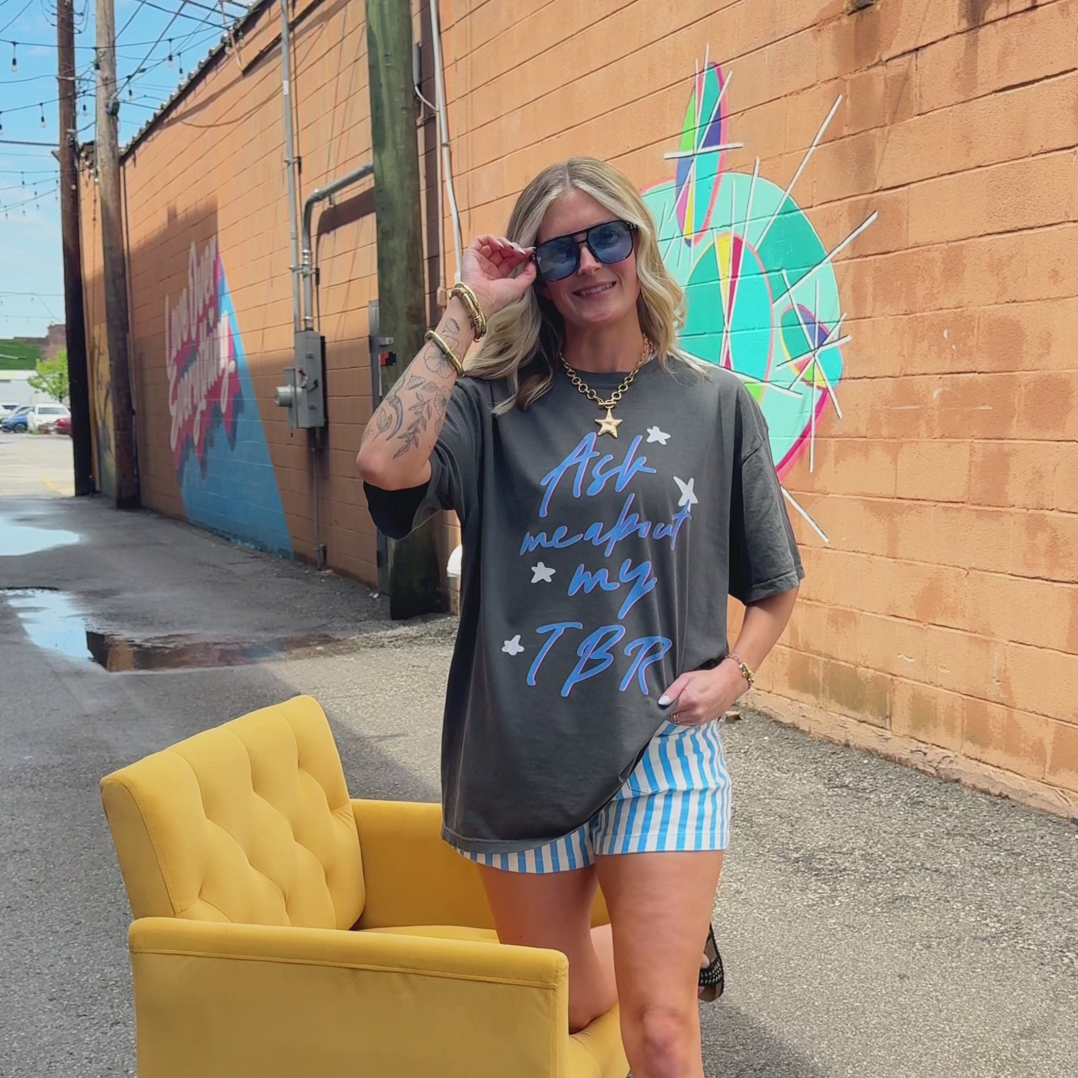 woman wearing ask me about my tbr tee