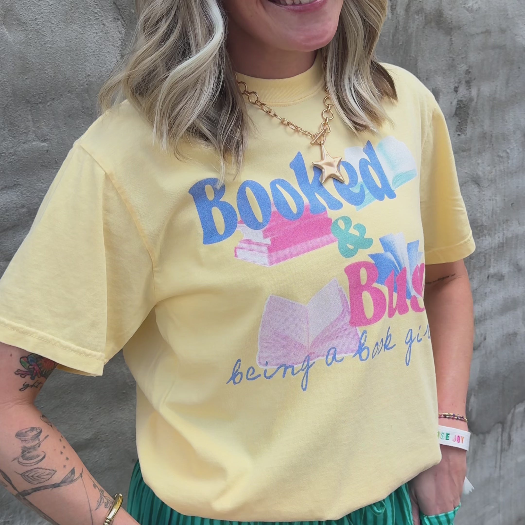 woman wearing booked and busy tee