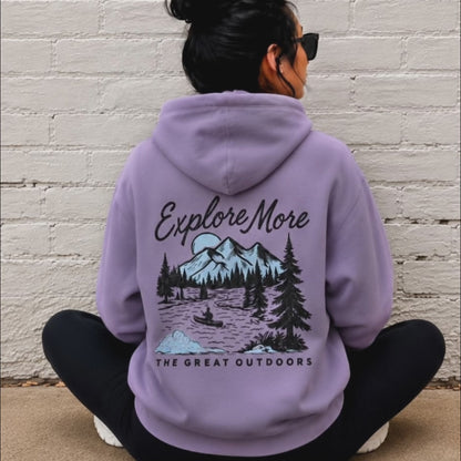 woman wearing explore more hoodie