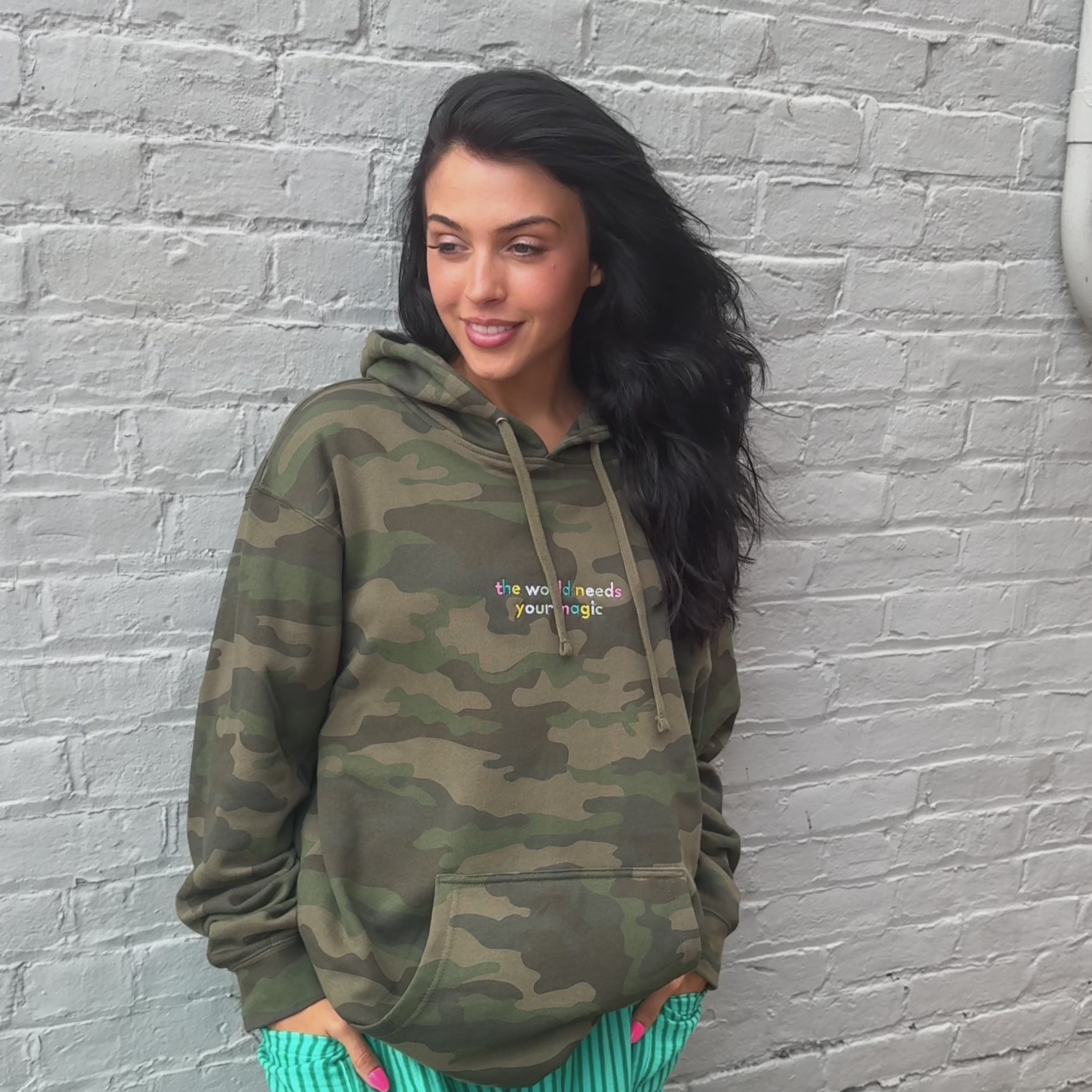 woman wearing World Needs Your Magic Embroidered Hoodie
