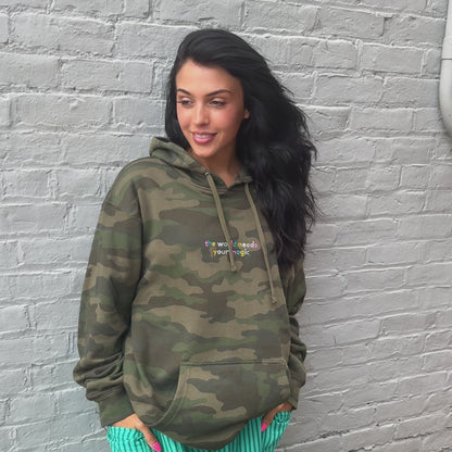 woman wearing World Needs Your Magic Embroidered Hoodie