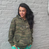 woman wearing World Needs Your Magic Embroidered Hoodie