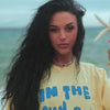 model wearing by the sea tee