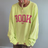 woman wearing bookish sweatshirt
